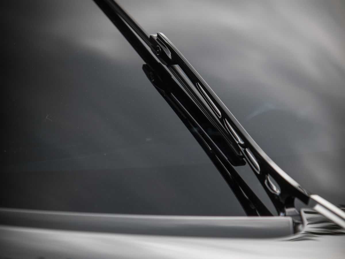 Close-up of a windscreen wiper arm on a modern car